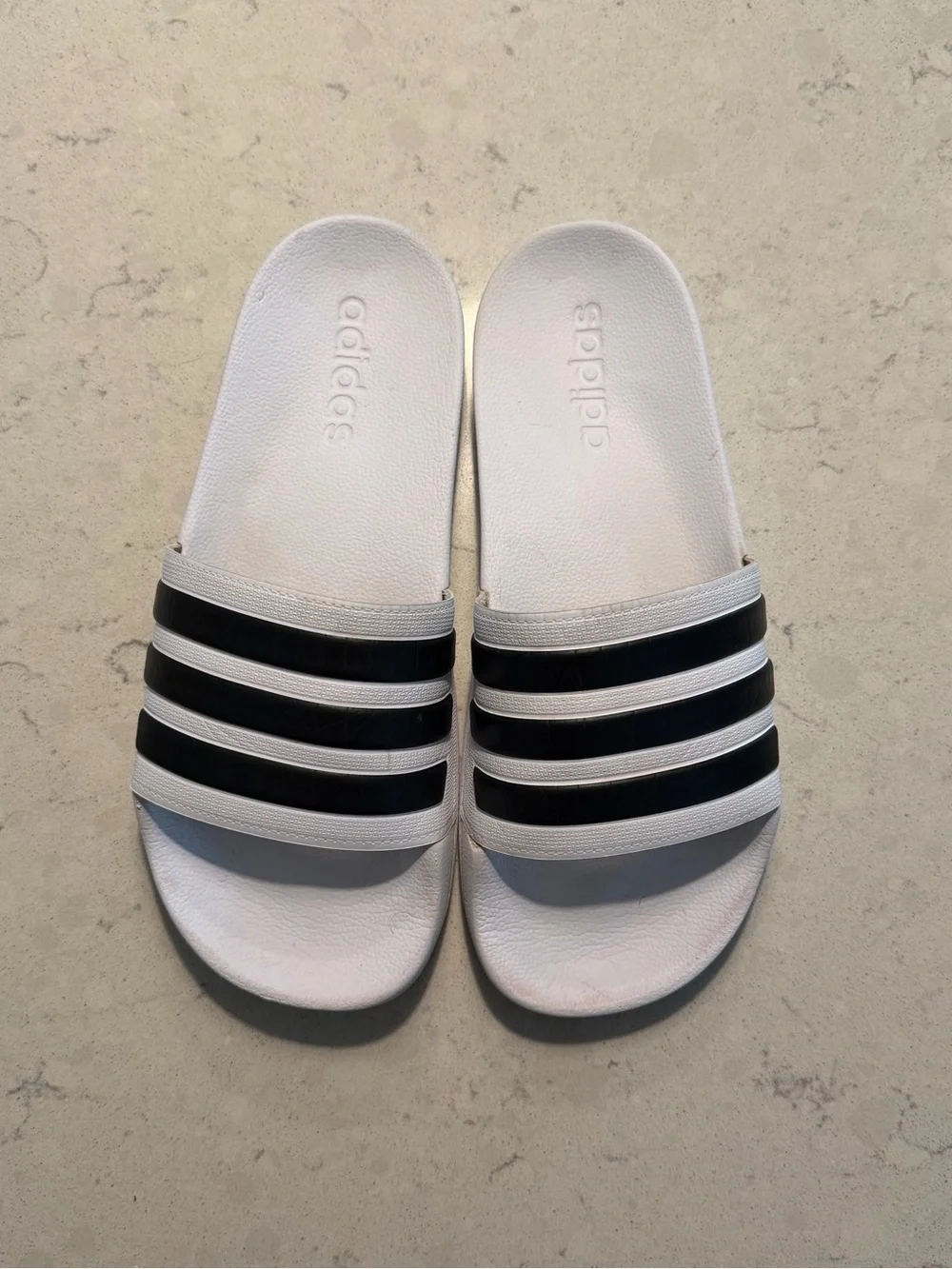 White and Black Adidas Slides - men’s size 8